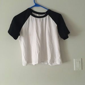 White short sleeve with black on the sleeves and on the neckline